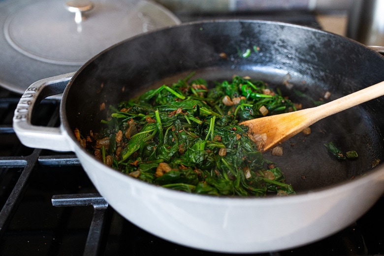 wilting the spinach for spinach lentil dal 