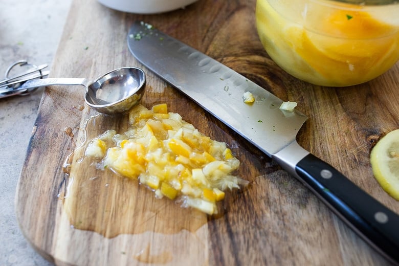 A simple recipe for Preserved Lemon Gremolata, an hearty zesty vegan condiment you'll want to put on everything! Delicious on grilled meats and fish, tossed with lentils, beans or pasta, or used as a dressing! #preservedlemon