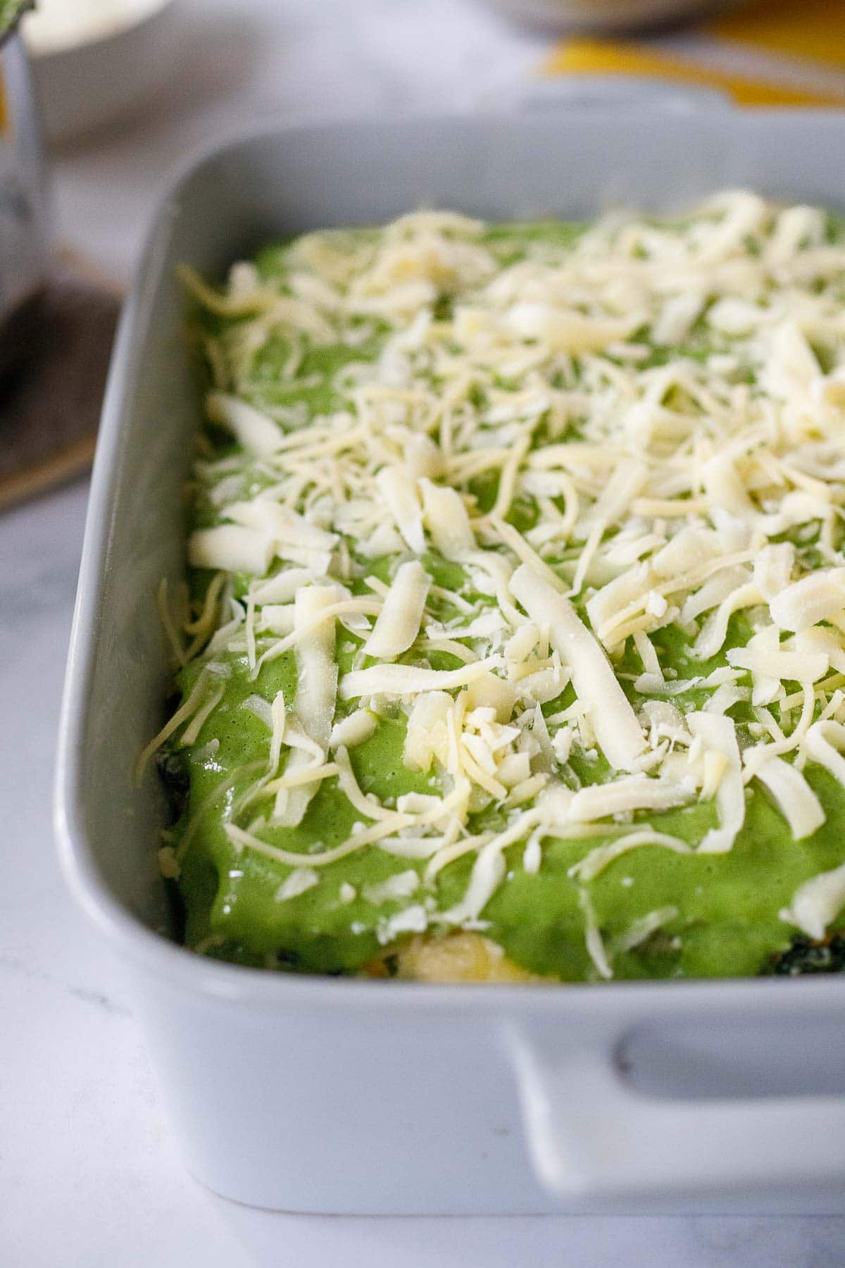 final layer of lasagna noodles topped with sauce and cheese. 