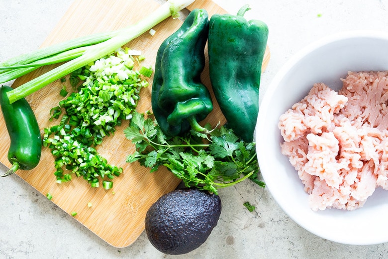 The best Turkey Burger Recipe with jalapeño, cilantro, lime zest, scallions , roasted poblano peppers and Chimichurri Mayo! Serve it in a bun or in a lettuce wrap! #turkeyburger #turkeyburgerrecipe