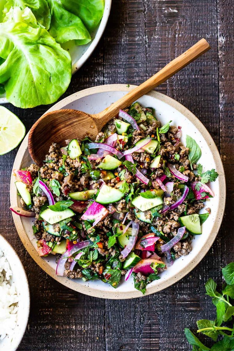 Thai Larb salad in a bowl with lettuce wraps