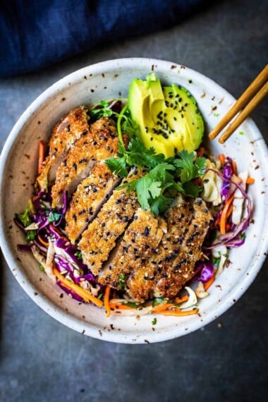 How to make Chicken Katsu - A Japanese Style fried chicken breaded with panko and sesame seeds. Serve over rice, veggies or as a sandwich or burger! A simple easy recipe the whole family will love. #katsu #chickenkatsu #chickenkatsusandwich #chickenkatsuburger