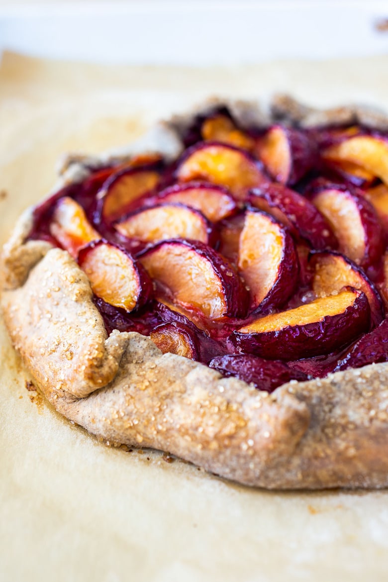 Plum Galette with juicy summer plums and a Buckwheat Crust. The buckwheat is super tasty - but optional here, so don't let it stop you! A pinch of five-spice adds a whisper of the exotic. #plumgalette #plumtart 