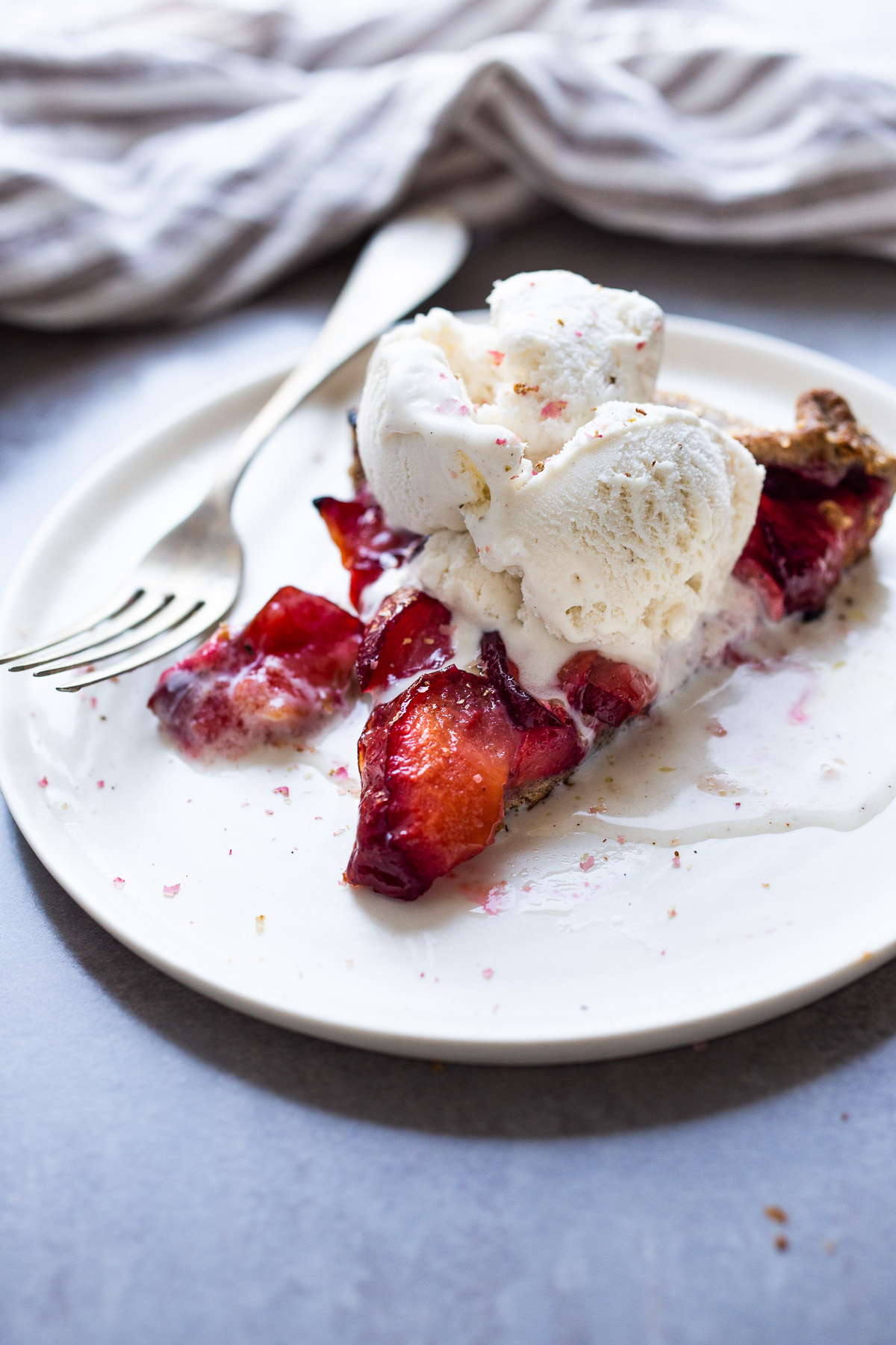 Juicy summer plums are highlighted in this simple recipe for Plum Galette with Buckwheat Crust. The buckwheat is super tasty - but optional here, so don't let it stop you! A pinch of five-spice adds a whisper of the exotic. #plumgalette #plumtart 