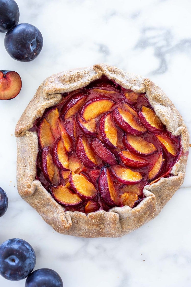 Juicy summer plums are highlighted in this simple recipe for Plum Galette with Buckwheat Crust. The buckwheat is super tasty - but optional here, so don't let it stop you! A pinch of five-spice adds a whisper of the exotic. #plumgalette #plumtart 