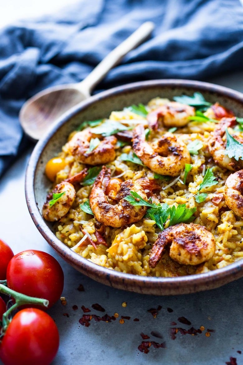 Summer Tomato Risotto with juicy vine-ripened tomatoes, and infused with saffron, can be served as a vegetarian main or sidedish, or topped off with smoky shrimp. #vegetarian #risotto #shrimprisotto 