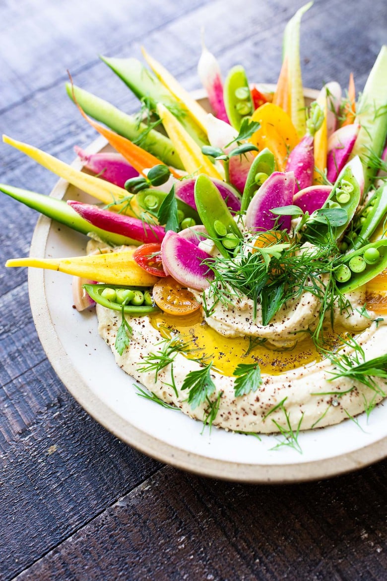 How to make Hummus! Truly, the BEST hummus recipe- creamy, authentic and so easy to make! Use canned or dried chickpeas & serve w/ veggies! 