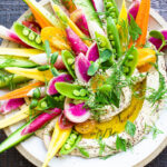 How to make Hummus! This authentic hummus recipe is light and creamy and so easy to make! Use canned or dried chickpeas and serve it up with fresh garden veggies! #hummus #hummusrecipe