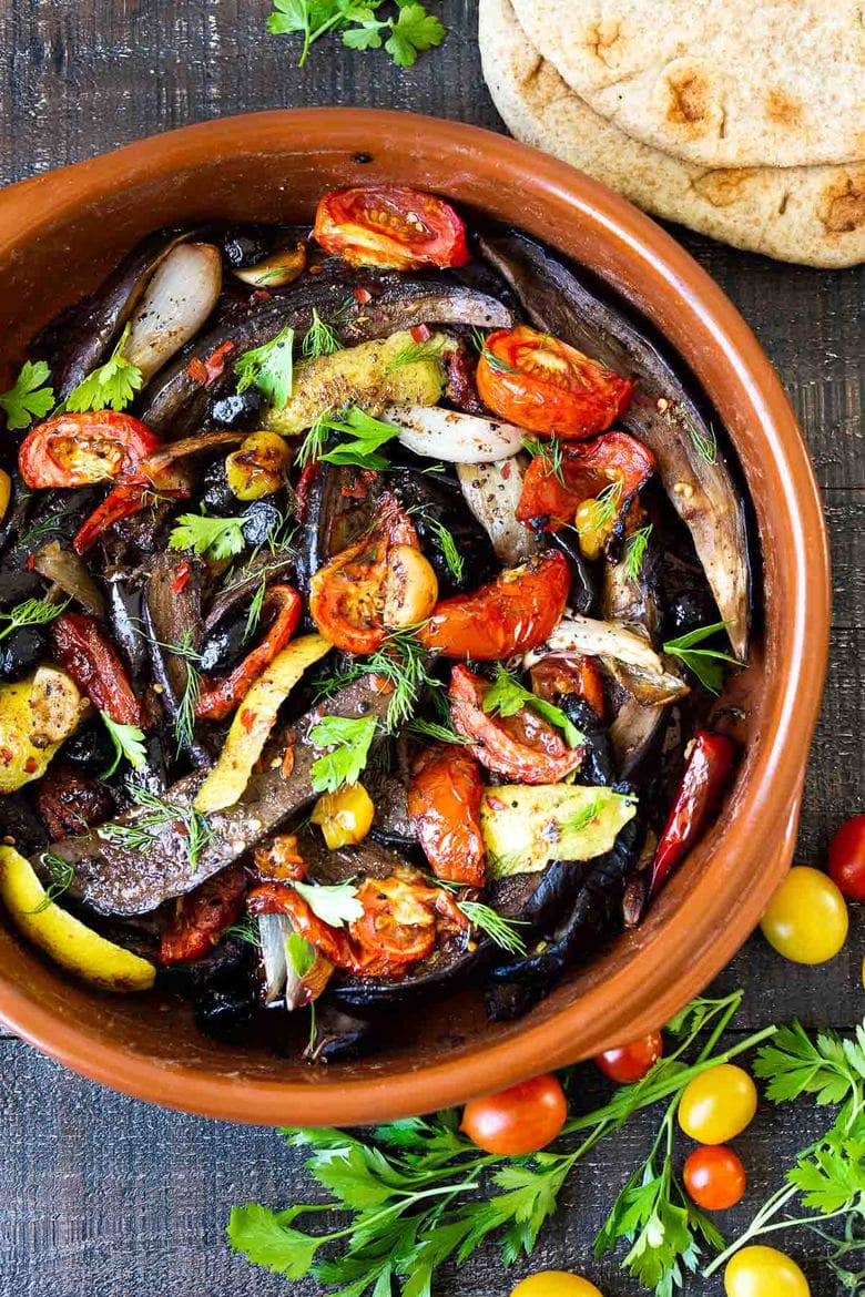 Slow-Baked Moroccan Eggplant with Ras el Hanout, caramelized garlic, shallots and tomatoes. A rustic side dish that can be turned into a hearty vegetarian main.  Serve with Basmati Rice or homemade Pita, and Tzatziki Sauce. #eggplant #vegetariandinner