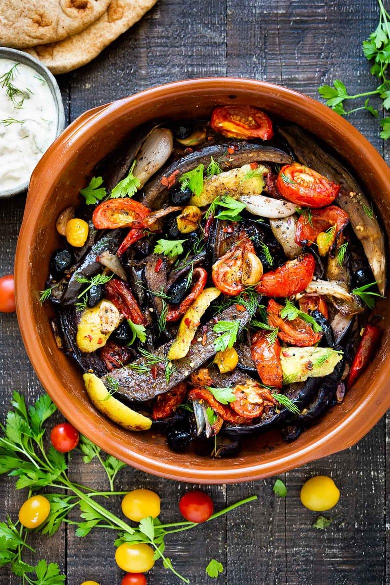 Slow-Baked Moroccan Eggplant with Ras el Hanout, caramelized garlic, shallots and tomatoes. A rustic side dish that can be turned into a hearty vegetarian main.  Serve with Basmati Rice or homemade Pita, and Tzatziki Sauce. #eggplant #vegetariandinner
