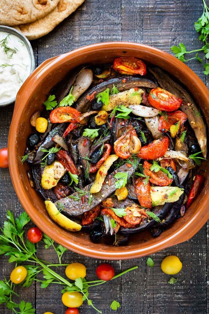 Slow-Baked Moroccan Eggplant with Ras el Hanout, caramelized garlic, shallots and tomatoes. A rustic side dish that can be turned into a hearty vegetarian main.  Serve with Basmati Rice or homemade Pita, and Tzatziki Sauce. #eggplant #vegetariandinner
