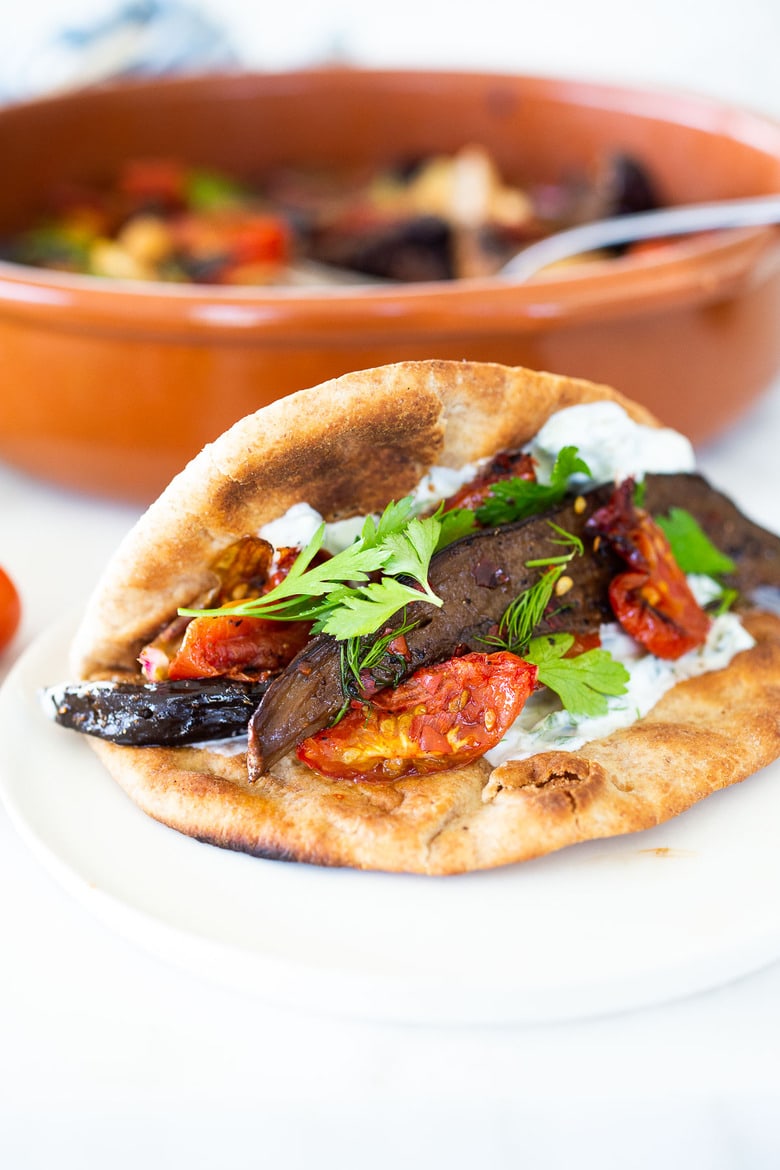 Slow-Baked Moroccan Eggplant with Ras el Hanout, caramelized garlic, shallots and tomatoes. A rustic side dish that can be turned into a hearty vegetarian main.  Serve with Basmati Rice or homemade Pita, and Tzatziki Sauce. #eggplant #veganrecipe #vegetariandinner