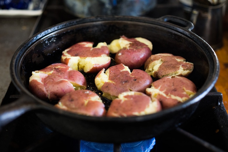 smash the potatoes and fry each side until crispy.