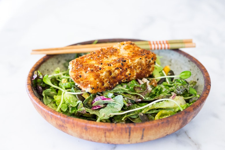 Tofu Katsu in a bowl over a salad