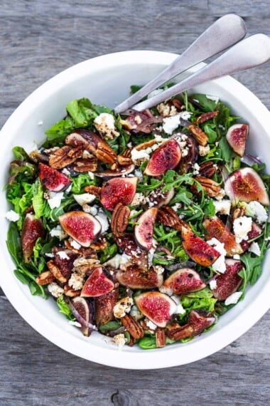 Here's one of our all-time favorite summer salads- Fig and Arugula Salad with Goat Cheese, Pecans and Basil tossed in a simple Balsamic Vinaigrette. #figsalad #figarugulasalad
