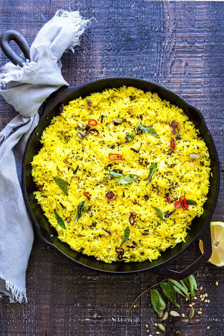 How to make Indian Lemon rice. Infused with Indian spices, this fragrant rice dish is the perfect side to your Indian meals. This color alone makes the potluck table happy! #lemonrice #indianrice #basmatirice