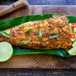 Here's a simple yet super flavorful recipe for Kerala-Style Fish, made with a flavorful paste that is either grilled or roasted in the oven. Curry leaves and Tamarind give this Indian Recipe its unique flavor. #kerala #keralafish #whitefish #indianrecipes