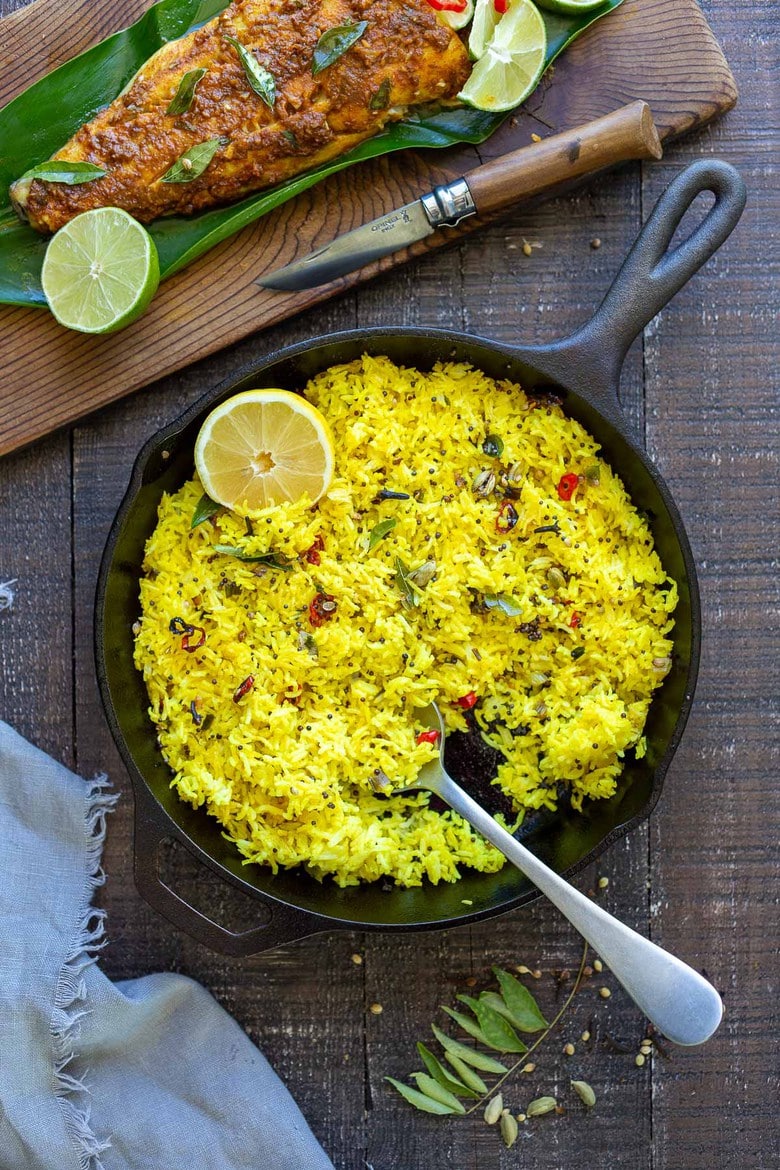 Kerala-Style Fish served with Lemon Rice. Curry leaves and Tamarind give this Indian Recipe its unique flavor. #kerala #keralafish #whitefish #indianrecipes