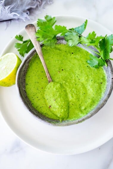 A delicious recipe for Peruvian Green Sauce  (Aji Verde) made with fresh chilies, cilantro, garlic and lime. This version can be made with or without mayo,  using cashews as the base (keeping it vegan & plant-based)  if you like. Vegan-adaptable. 