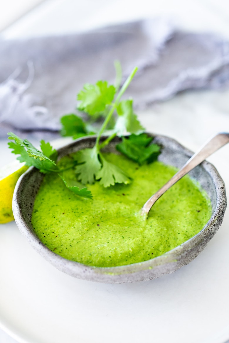 Peruvian Green Sauce (Aji Verde)! This recipe is vegan-adaptable, so you can skip the mayo if you prefer. A spicy, tangy flavorful condiment that is delicious on so many things! #ajiverde #peruviangreensauce #vegan