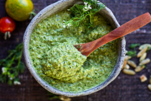 This flavorful Poblano Pumpkin Seed Sauce is made with roasted poblano peppers and pumpkin seeds- a tasty addition to tacos, enchiladas, or burrito bowls! #poblanosalsa #pepitasalsa #poblanosauce #pepitasauce