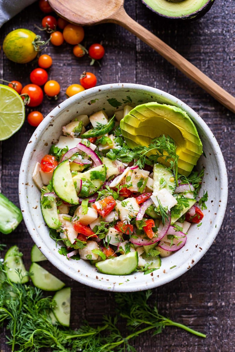 This vegan, plant-based Ceviche will transport you to Mexico. Made with hearts of palm and avocado, this easy recipe can be served on tostadas, with chips or in lettuce cups! #veganceviche #heartsofpalm #veganmexican #ceviche