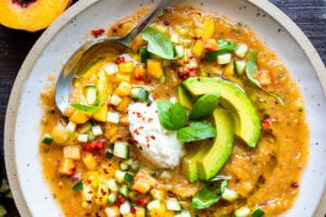 Tomato Peach Gazpacho with Basil and Burrata -a chilled summer soup that is cooling and refreshing and easy to whip up. Vegan-adaptable! #gazpacho #peachrecipes #tomatorecipes #summerrecipes #chilledsoup