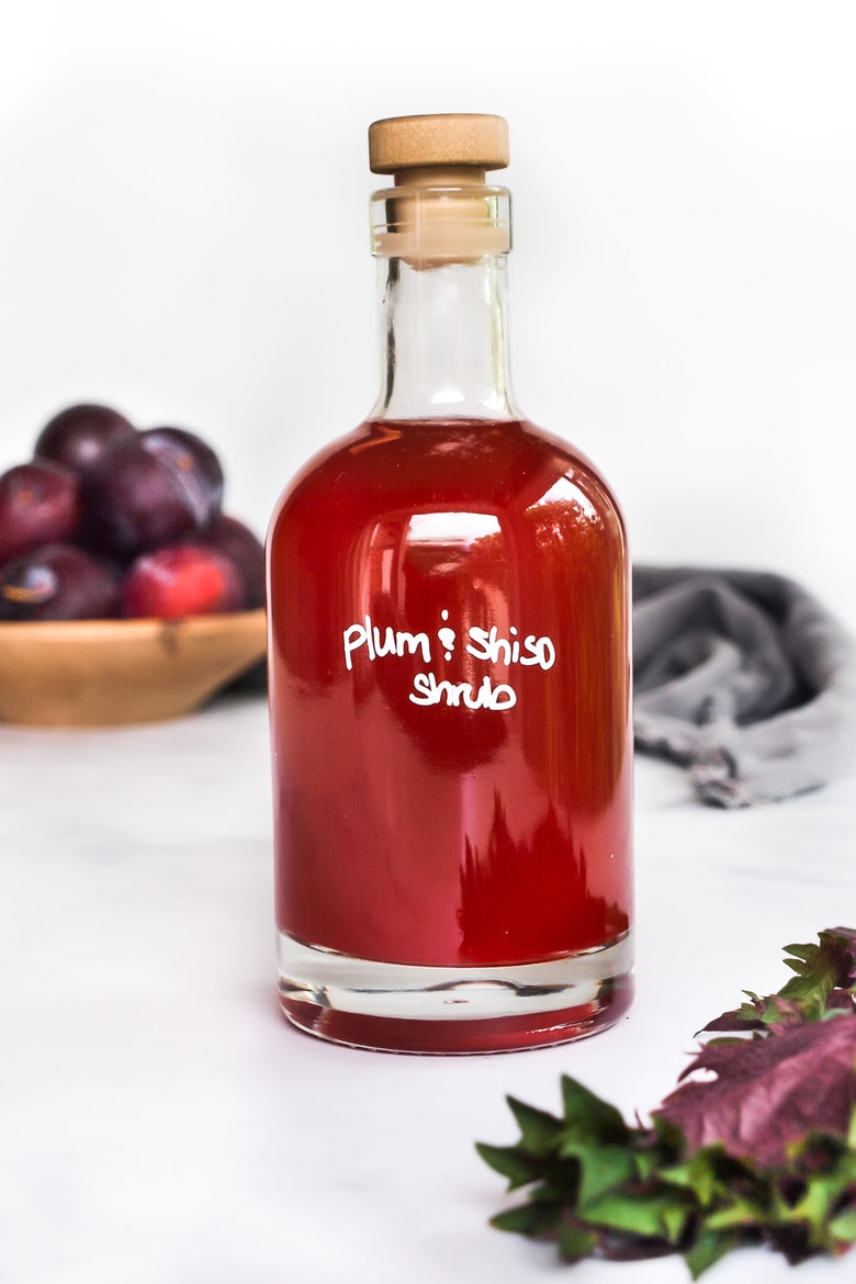 How to make a shrub, a flavorful, fruit-infused drinking vinegar used in cocktails, mocktails, vinaigrettes and sauces! This makes for a beautiful hostess gift! 