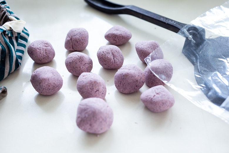 making balls of masa dough. 