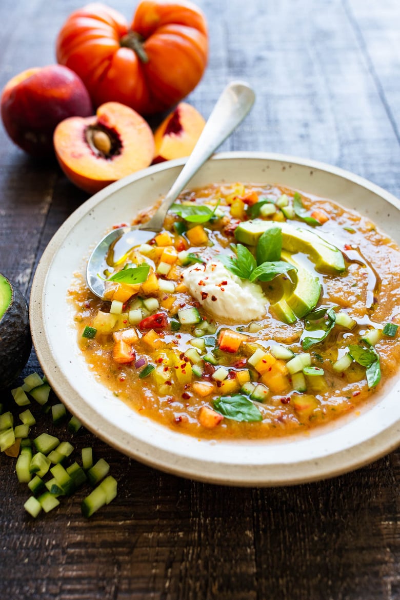 Tomato Peach Gazpacho with Basil and Burrata -a chilled summer soup that is cooling and refreshing and easy to whip up. Vegan-adaptable! #gazpacho #peachrecipes #tomatorecipes #summerrecipes #chilledsoup