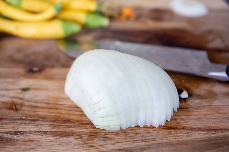 chopping onions for zucchini quesadillas 