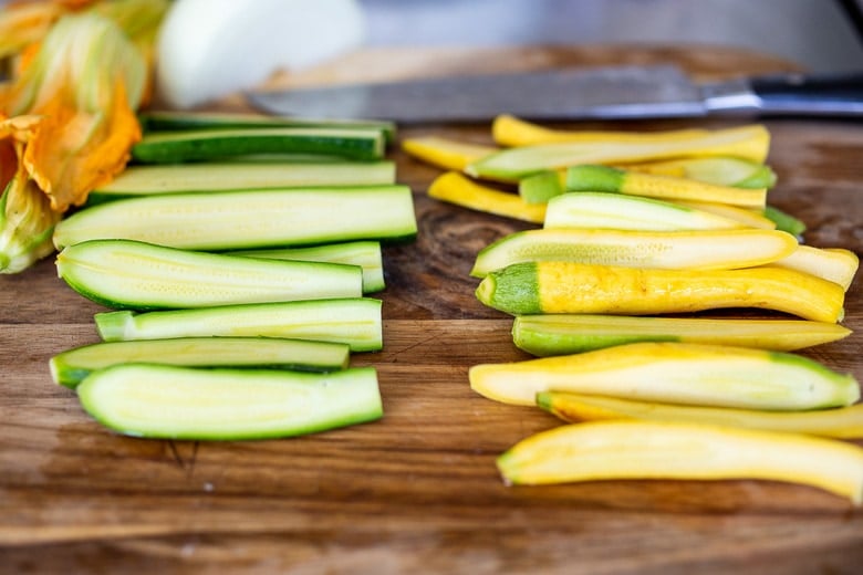 chopping zucchini for vegan quesadillas 