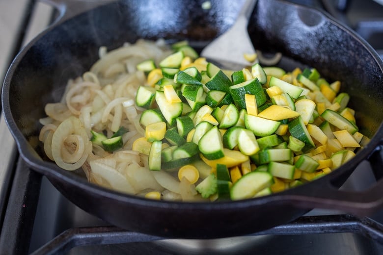 sauting onions and zucchini for vegan quesadillas