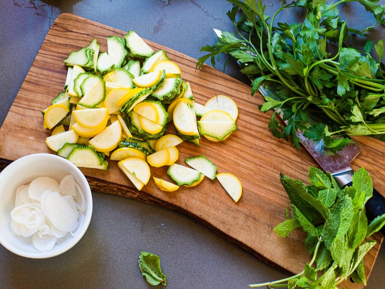 Farro Salad with Marinated Zucchini & Chickpeas, fresh herbs and optional feta, tossed a simple lemony dressing. #farrosalad #vegansalad #zucchinirecipes #chickpeasalad 