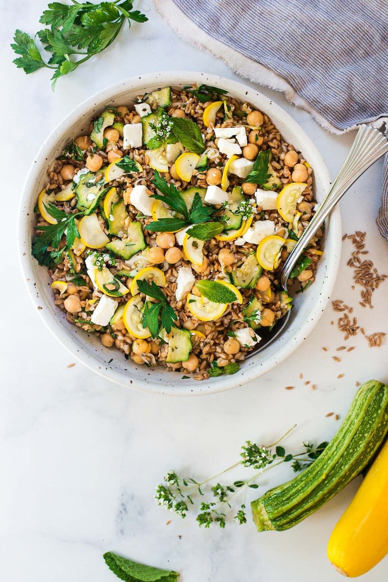 Our 20 Best Zucchini Recipes: Mediterranean Farro Salad with Marinated Zucchini & Chickpeas, fresh herbs and optional feta, tossed a simple lemony dressing. #farrosalad #vegansalad #zucchinirecipes #chickpeasalad