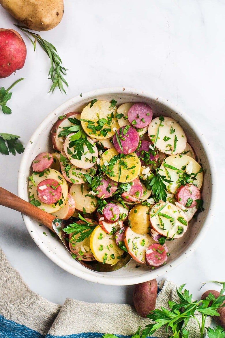 A simple French Potato Salad with fresh herbs - tarragon, parsley and chives, with a flavorful Dijon Vinaigrette. Healthy, vegan and light with no mayo!  