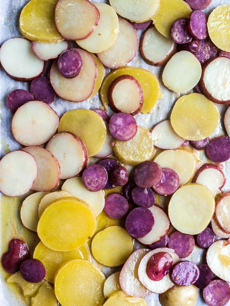 This French Potato Salad is loaded up with fresh herbs - tarragon, parsley and chives and dressed in the most flavorful dijon vinaigrette. It's vegan, with no mayo, and easy. to make! #herbedpotatosalad #frenchpotatosalad #veganpotatosalad