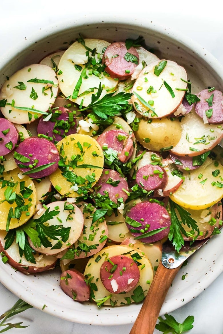 30 Vibrant Healthy Spring Recipes : This French Potato Salad is loaded up with fresh herbs - tarragon, parsley and chives and dressed in the most flavorful dijon vinaigrette. It's vegan, with no mayo, and easy. to make! #herbedpotatosalad #frenchpotatosalad #veganpotatosalad