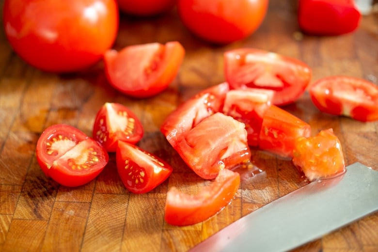 chopping the tomatoes for tomato soup