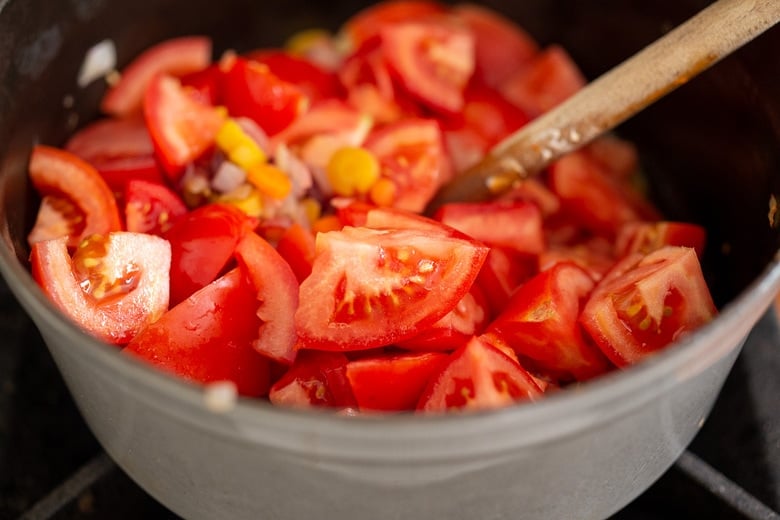 Cooking tomatoes down for tomato soup.