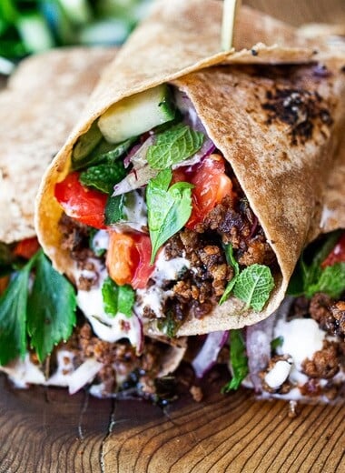 Turkish Lamb Wrap with ground lamb, sumac, mint, cucumbers, tomatoes and yogurt.