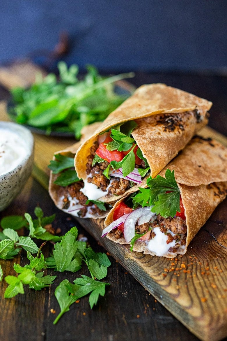 Fast and flavorful, Turkish Lamb Wraps are made with savory ground lamb seasoned with flavorful Turkish spices, wrapped up in a tortilla with labneh, cucumbers, tomatoes, mint, parsley and peppery watercress. A simple weeknight dinner that can be made in under 30 minutes. #lamb #americanlamb #lambwrap #turkishwrap 