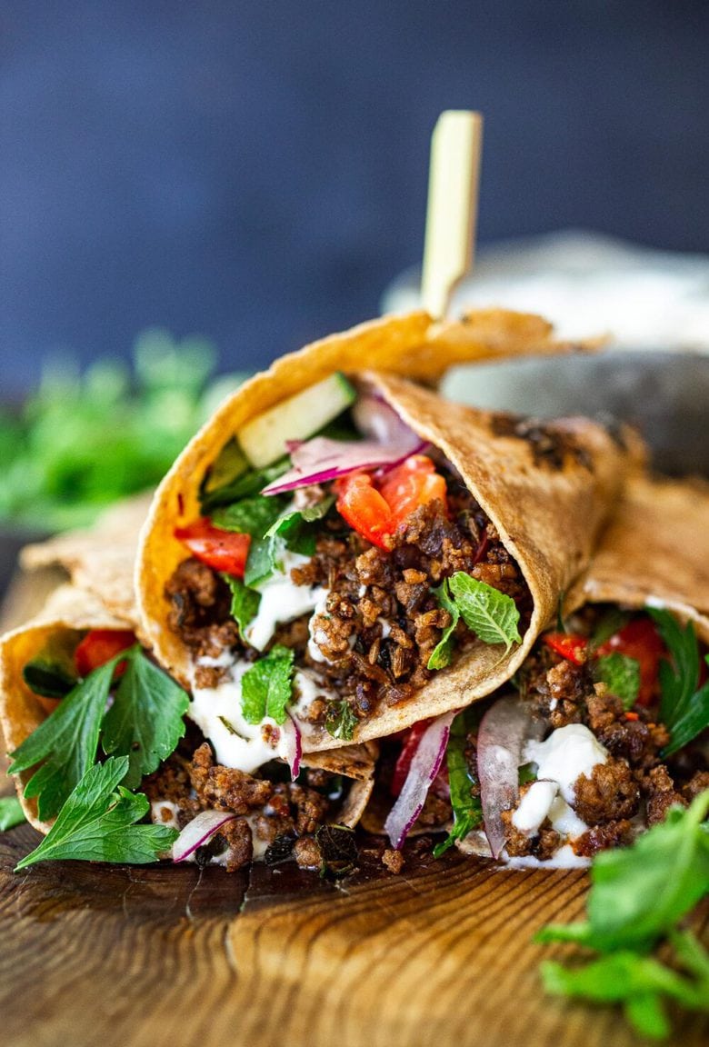 Fast and flavorful, Turkish Lamb Wraps are made with savory ground lamb seasoned with flavorful Turkish spices, wrapped up in a tortilla with labneh, cucumbers, tomatoes, mint, parsley and peppery watercress. A simple weeknight dinner that can be made in under 30 minutes. #lamb #americanlamb #lambwrap #turkishwrap