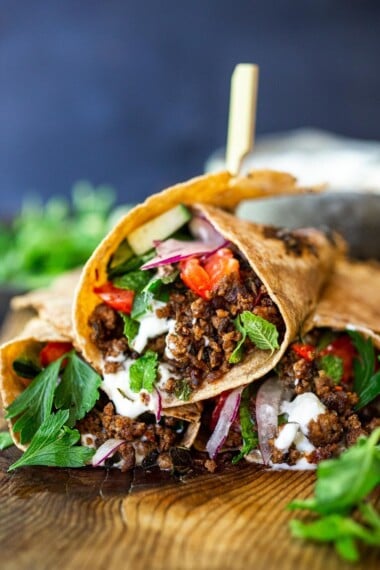 Fast and flavorful, Turkish Lamb Wraps are made with savory ground lamb seasoned with flavorful Turkish spices, wrapped up in a tortilla with labneh, cucumbers, tomatoes, mint, parsley and peppery watercress. A simple weeknight dinner that can be made in under 30 minutes. #lamb #americanlamb #lambwrap #turkishwrap