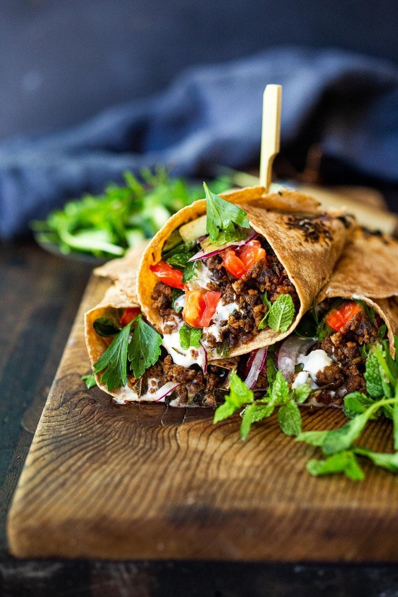 Fast and flavorful, Turkish Lamb Wraps are made with savory ground lamb seasoned with flavorful Turkish spices, wrapped up in a tortilla with labneh, cucumbers, tomatoes, mint, parsley and peppery watercress. A simple weeknight dinner that can be made in under 30 minutes. #lamb #americanlamb #lambwrap #turkishwrap