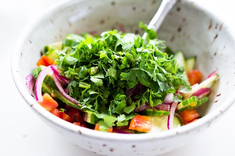 This vegan, plant-based Ceviche will transport you to Mexico. Made with hearts of palm and avocado, this easy recipe can be served on tostadas, with chips or in lettuce cups! #veganceviche #heartsofpalm #veganmexican #ceviche