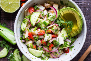 This vegan, plant-based Ceviche will transport you to Mexico. Made with hearts of palm and avocado, this easy recipe can be served on tostadas, with chips or in lettuce cups! #veganceviche #heartsofpalm #veganmexican #ceviche