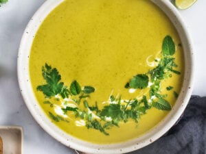 Curried Zucchini Soup with ginger and mint. A fast and easy vegan-adaptable soup that is healthy and flavorful.