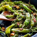 Blistered Shishito Peppers- a fast and easy appetizer that comes together in under 15 minutes! #shishito #shishitopeppers