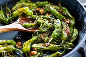 Blistered Shishito Peppers- a fast and easy appetizer that comes together in under 15 minutes! #shishito #shishitopeppers